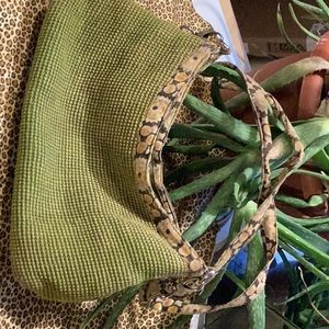 Cute lightly used Green Jute bag perfect for the season. It has 3 inside pockets